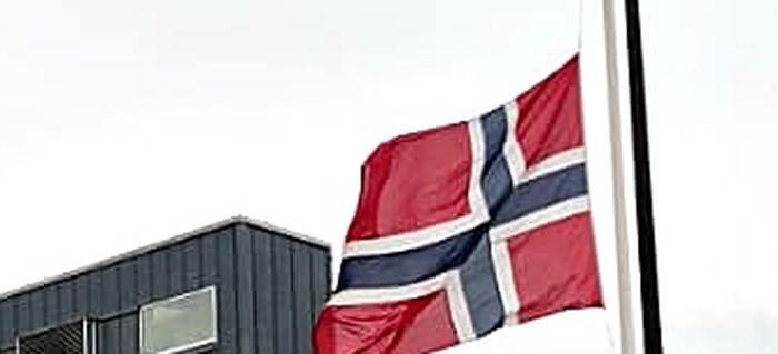 The Norwegian flag at half-mast over Sentralhallen, Oddemarka, in Kristiansand on the day of the King's passing.